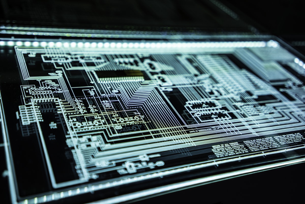 Glowing circuit board representing scalable AI agent backends.