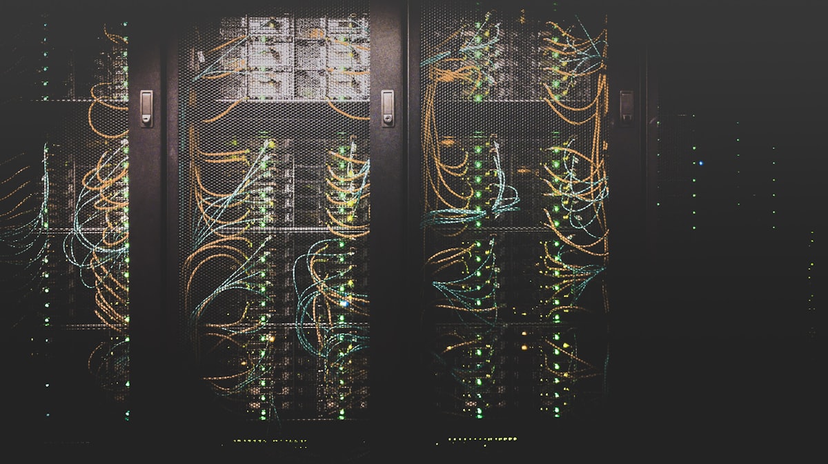 Data-center server racks with cabling representing batch compute jobs.